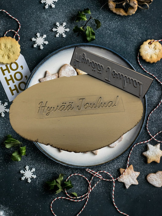 “Hyvää Joulua!” kumileimasin – 3D-tulostettu kädensija