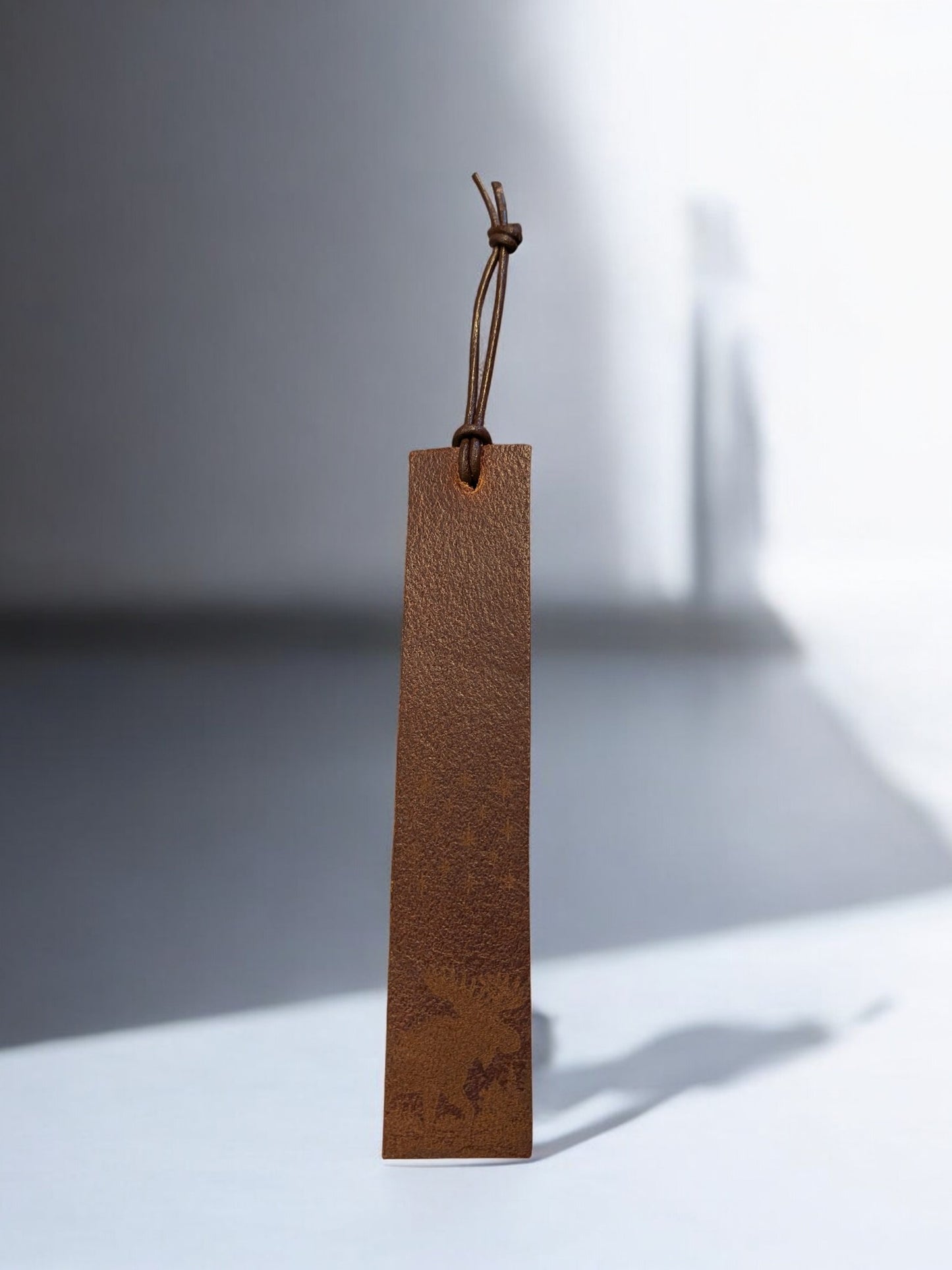 Leather bookmark with subtle engraved moose design