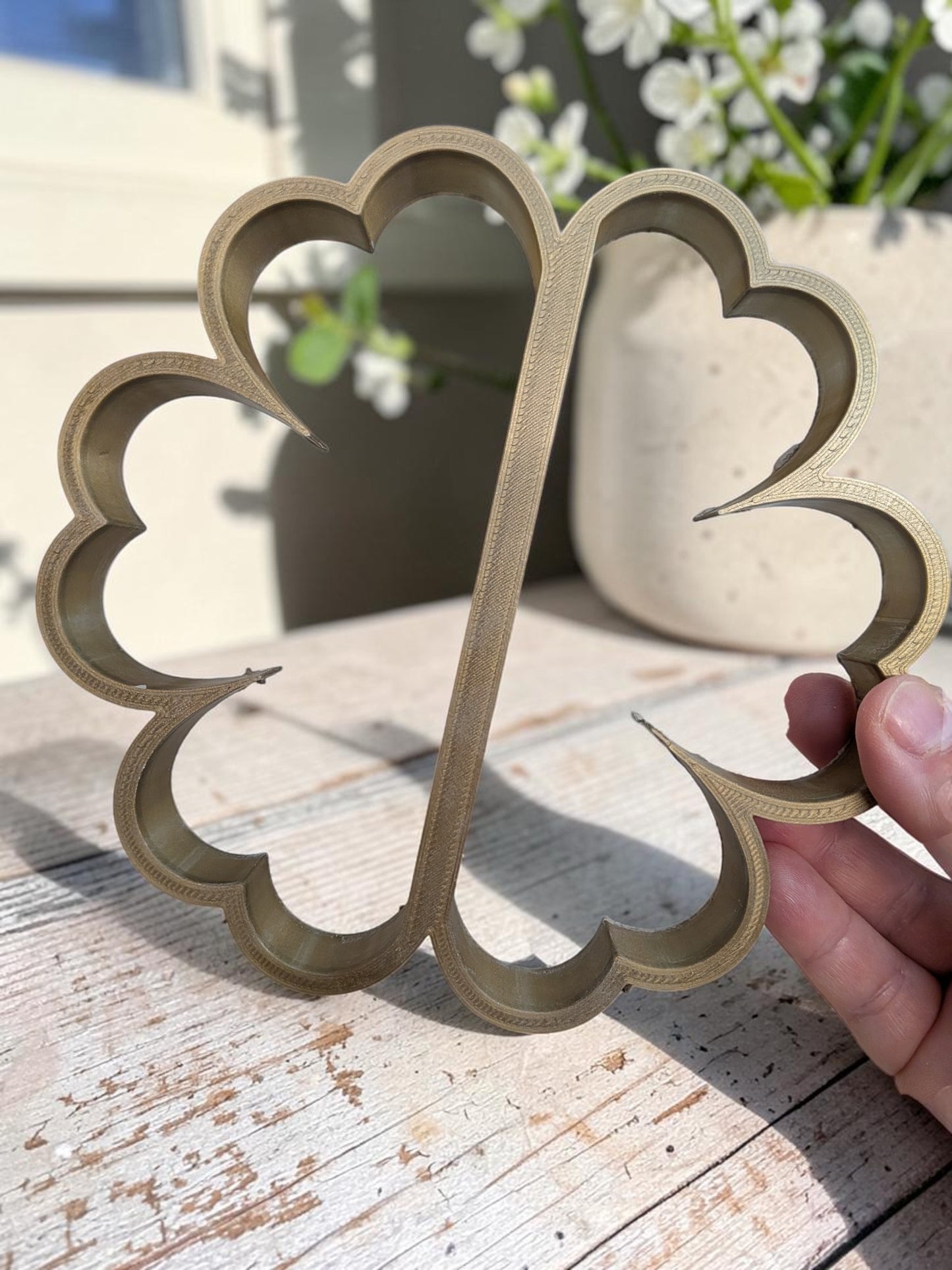 Flower shaped clay cutter used to make cup-like garden flowers